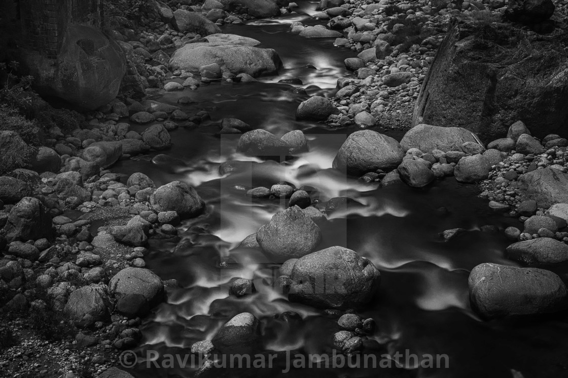 "Flowing through Boulders" stock image