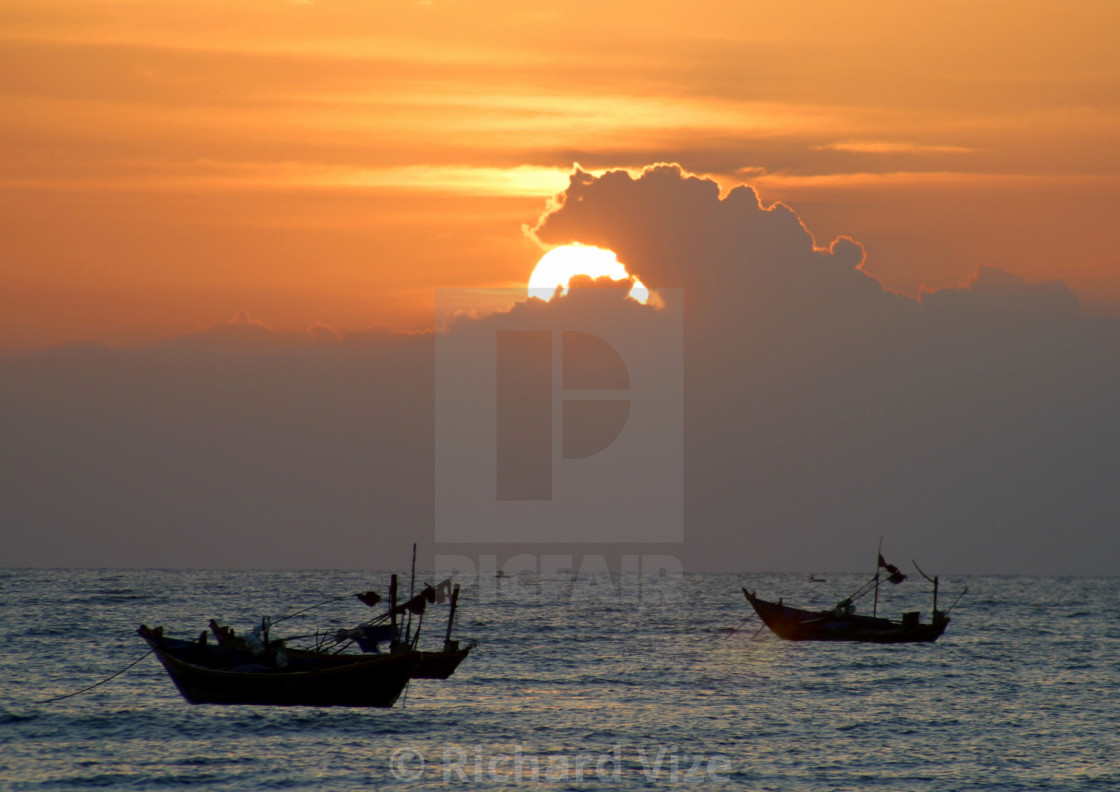 "Fishing boats at sunset from Phan Thiet beach, Vietnam" stock image