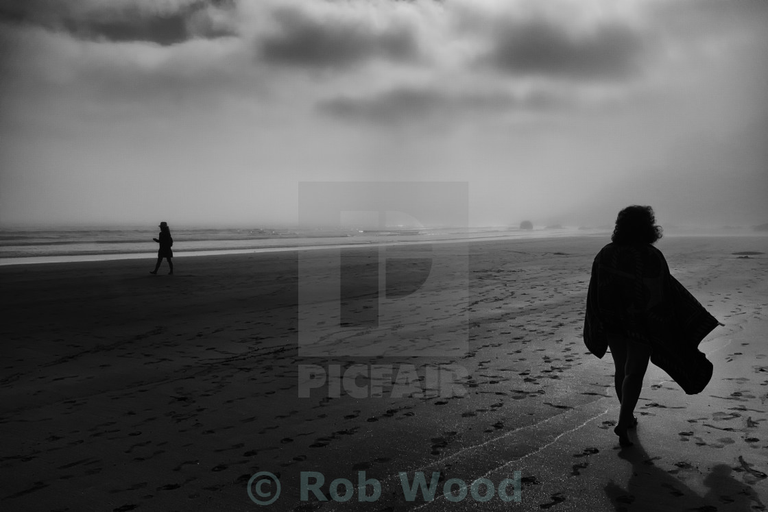 "Figures on a Misty Beach" stock image