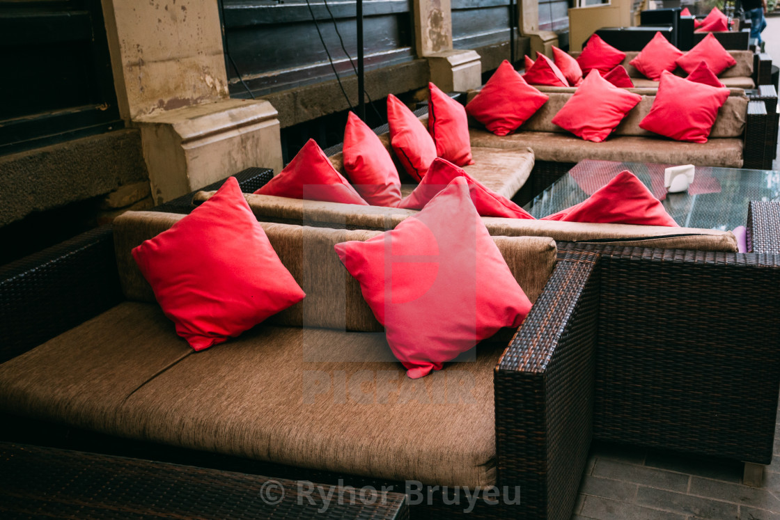 Red Pillows Lie On Comfortable Sofas Street Cafes License