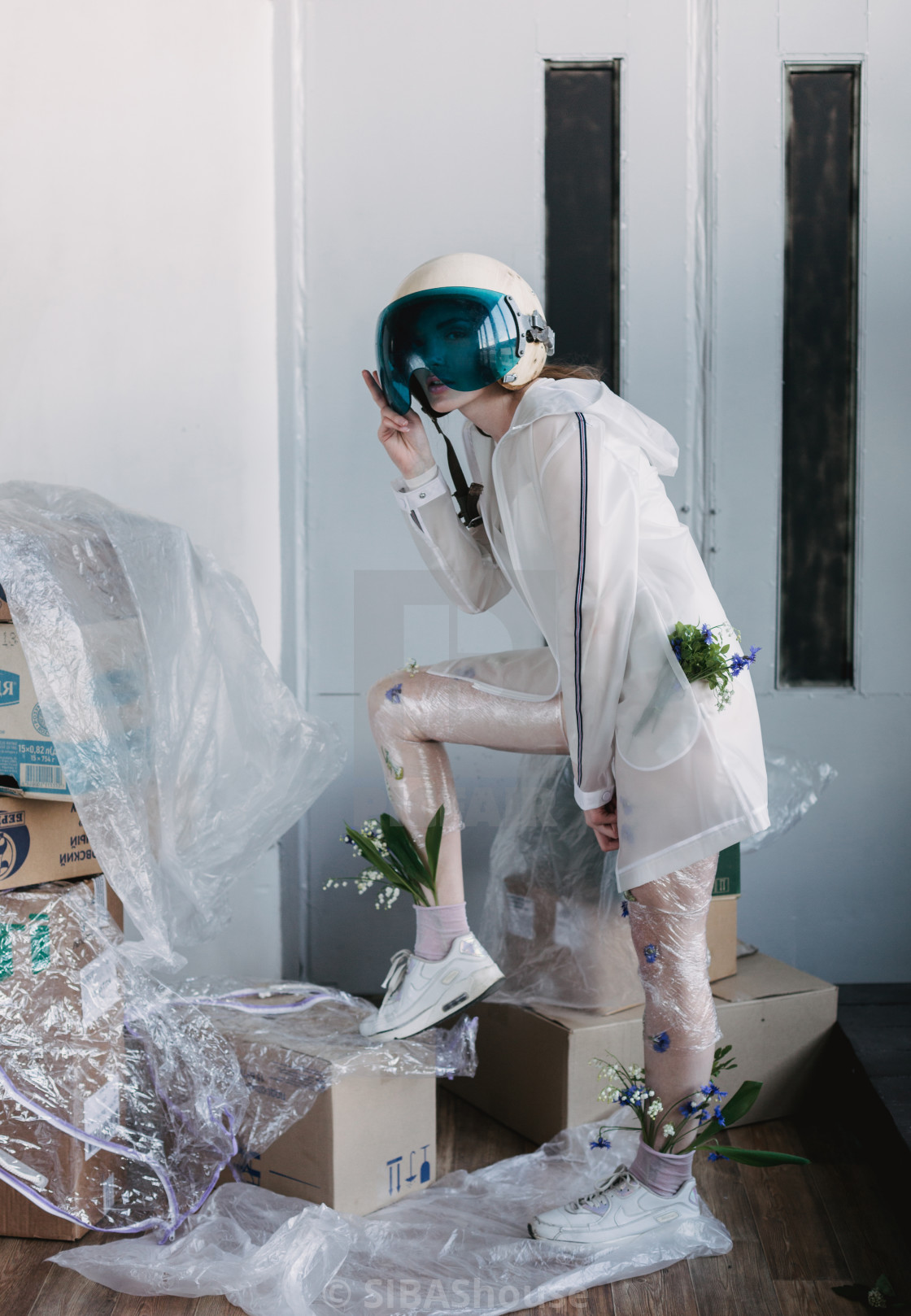Fashion Portrait Of Girl In Plastic Trend Clothes With Space