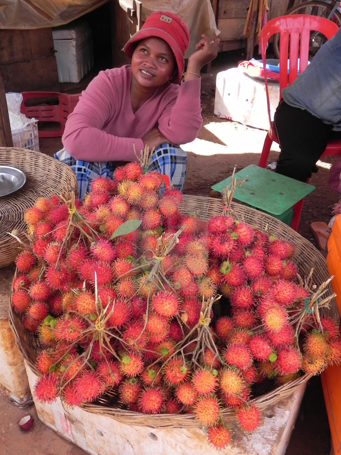 "Rambutan Lady, Cambodia" by Sal Bolton - $10.70 "Rambutan Lady, Cambodia" stock image
