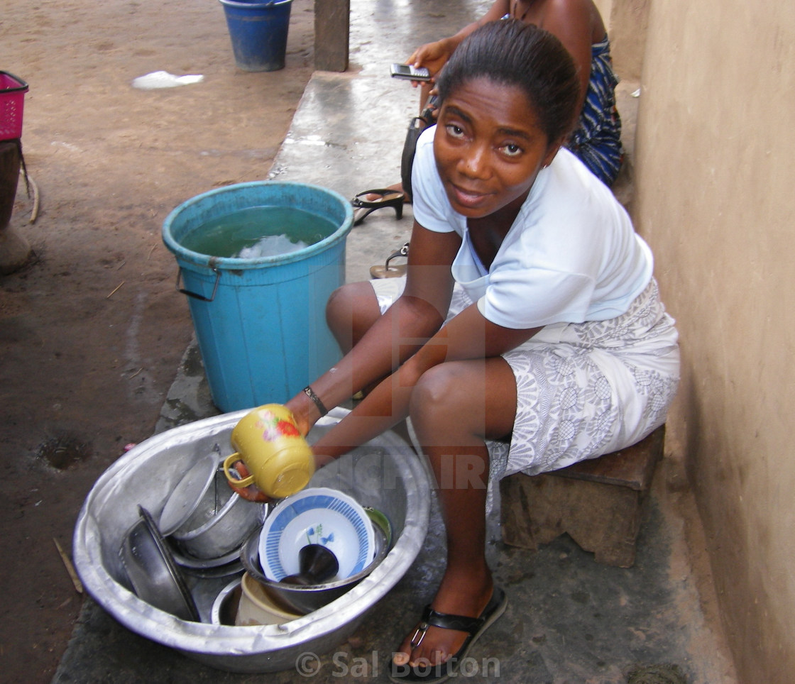 "Ghanian lady washing bowl" by Sal Bolton - $10.70 "Ghanian lady washing bowl" stock image