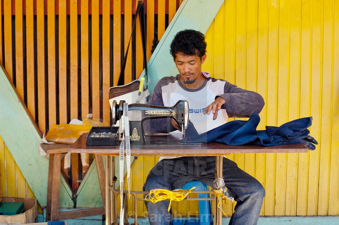 "Sewing on the street" stock image