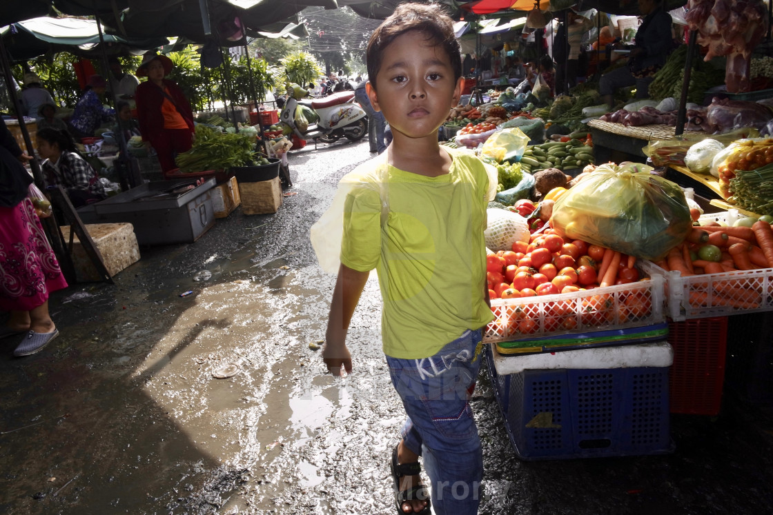 "Young boy in market" stock image