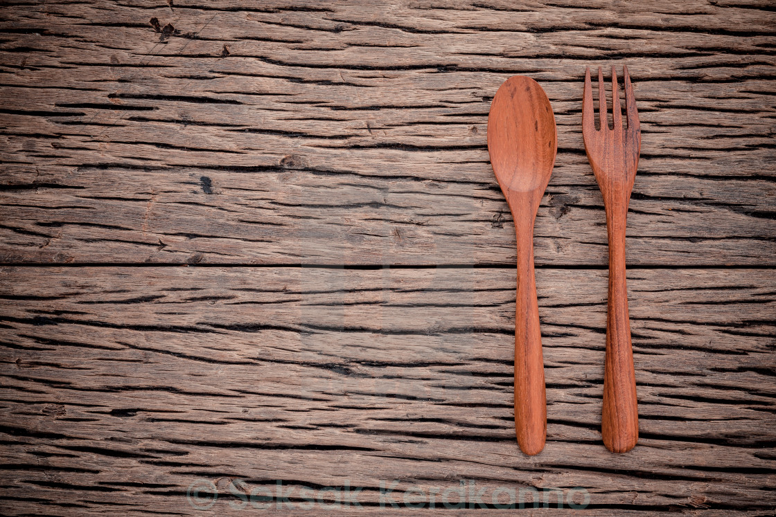 Fork and spoon on grunge wood food background concept ,menu design and  advertising campaign. - License, download or print for £ | Photos |  Picfair