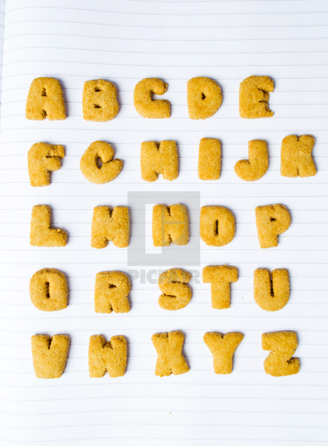 Alphabet Shaped Cookies On A Notebook License Download Or Print For 8 06 Photos Picfair