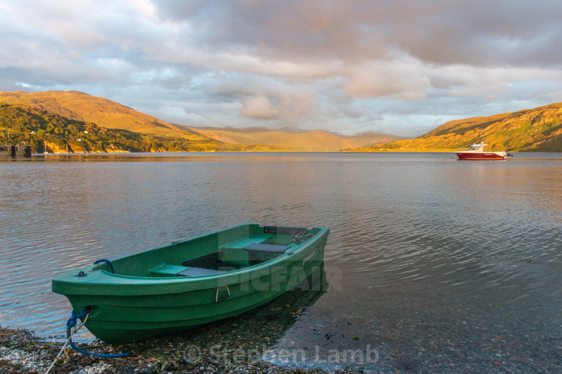 "A Boat at Sunset" stock image