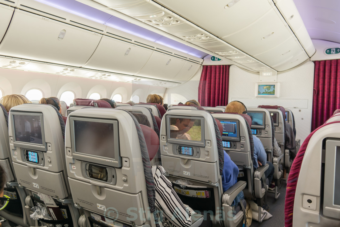 Passengers Relax In The Spacious Cabin Of Boeing 787 8