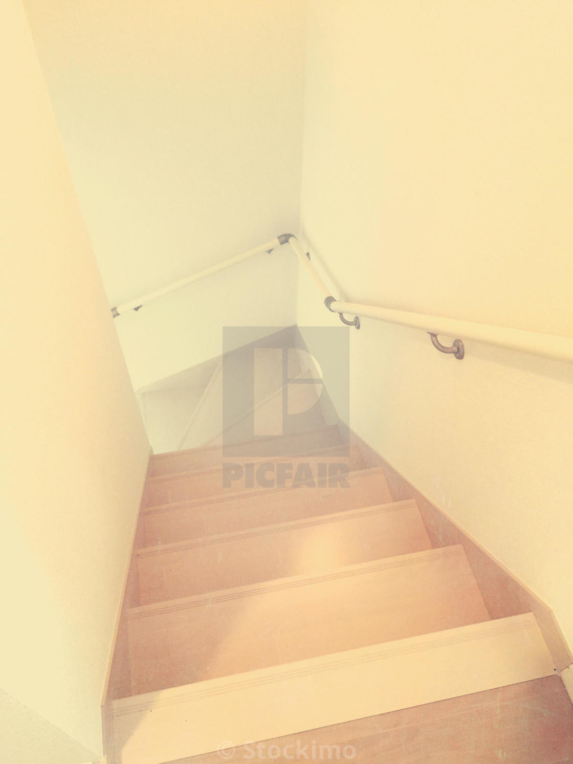 Simple Narrow Staircase With Light Brown Wood White Walls