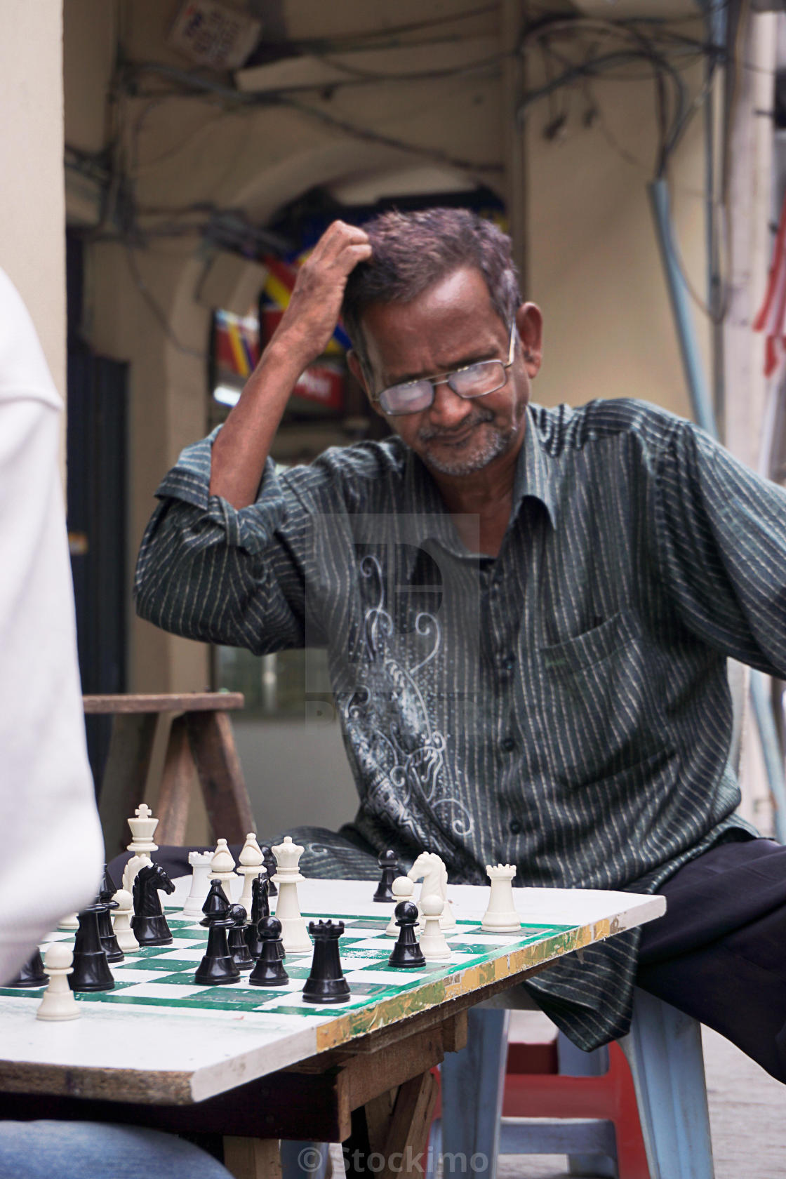 Playing Chess. Man Thinking About His Next Chess Move Stock Photo by  microgen