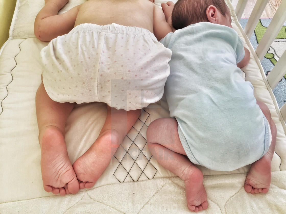 "Brother and sister sleeping together" stock image. 