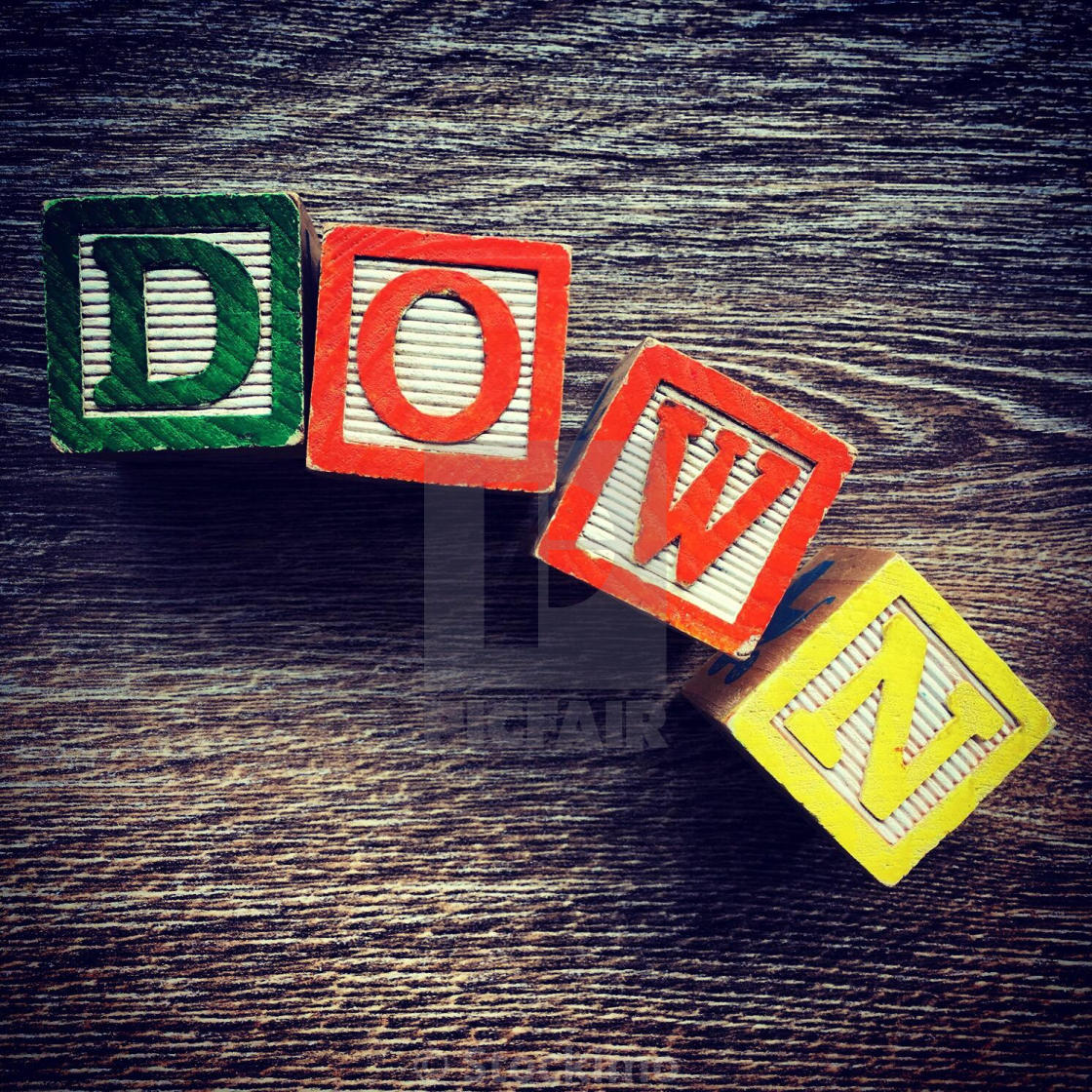 "DOWN word written with alphabet wood block letter toys" stock image