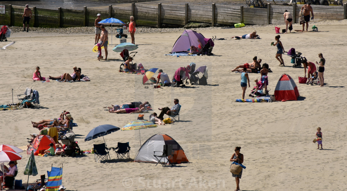 "Enjoying Lyme Regis Beach" stock image