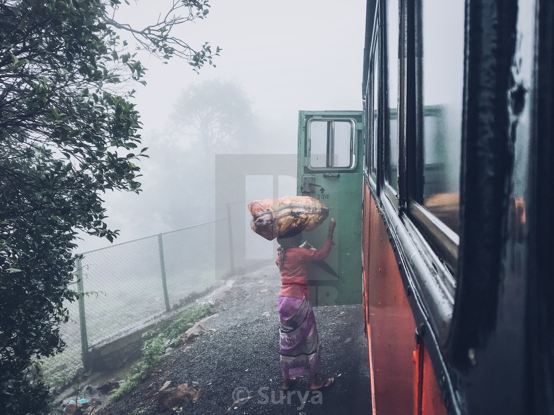 "Women Getting into a bus to sell Her goods in the city" by Surya - $123.16 "Women Getting into a bus to sell Her goods in the city" stock image