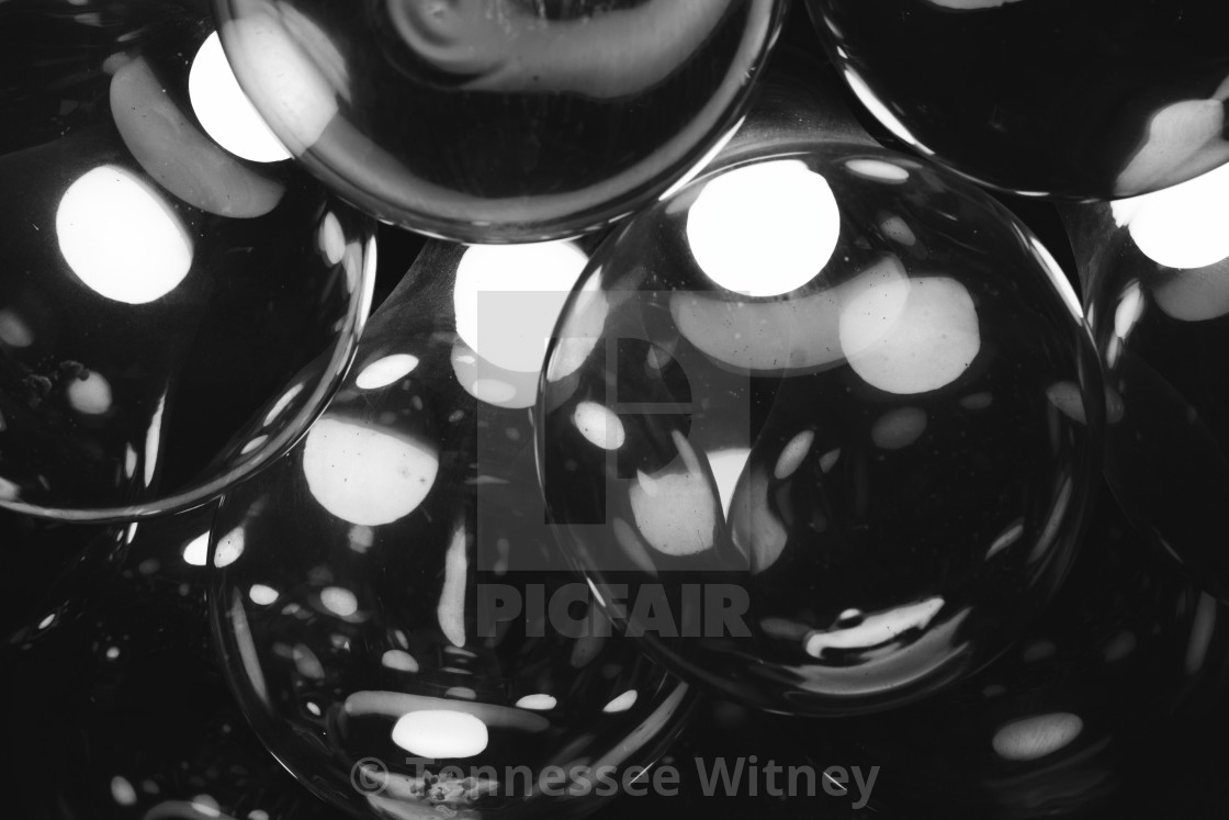 "Abstract black and white glass light bulbs with a warm glow" by Tennessee Witney - £4.91 "Abstract black and white glass light bulbs with a warm glow" stock image