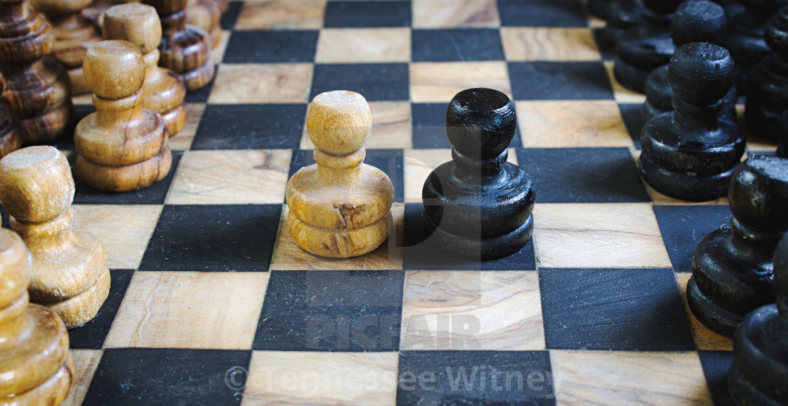 "Old olive wood chess set board with staunton pieces and black and white pawns..." by Tennessee Witney - £4.91 "Old olive wood chess set board with staunton pieces and black and white pawns..." stock image
