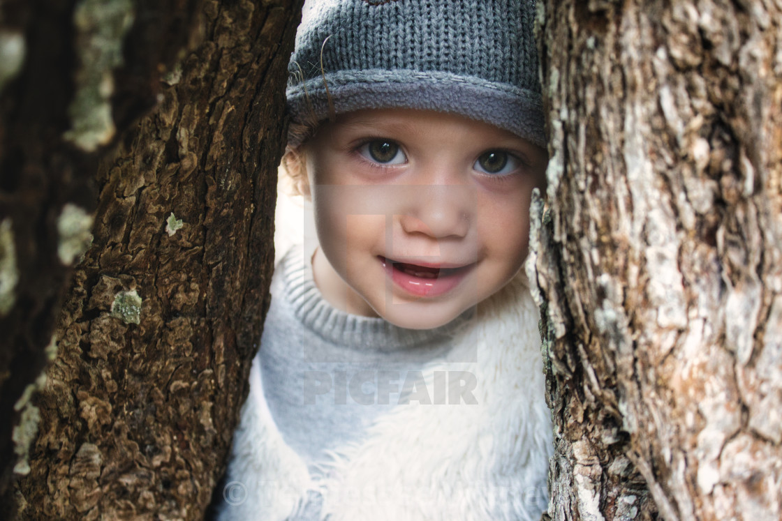 "Close up of beautiful young girl model smiling and peering through a gap..." by Tennessee Witney - £4.91 "Close up of beautiful young girl model smiling and peering through a gap..." stock image