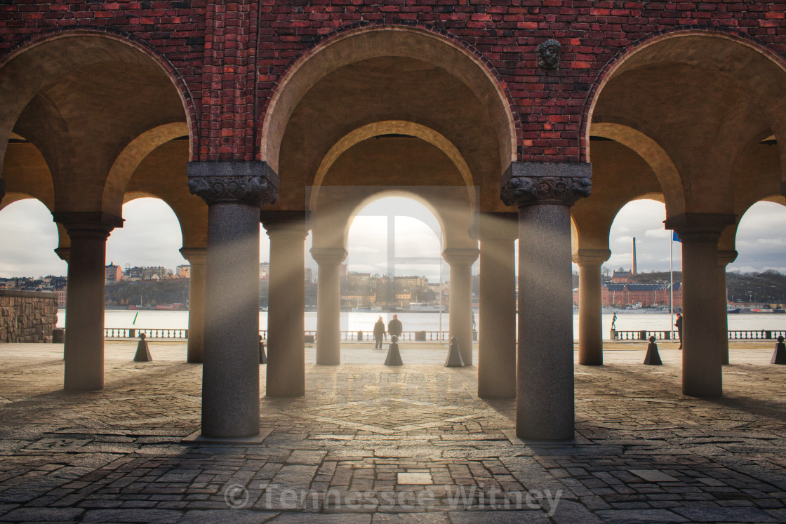 "Sun shining through he arches from the courtyard of the City Hall in..." by Tennessee Witney - £4.91 "Sun shining through he arches from the courtyard of the City Hall in..." stock image