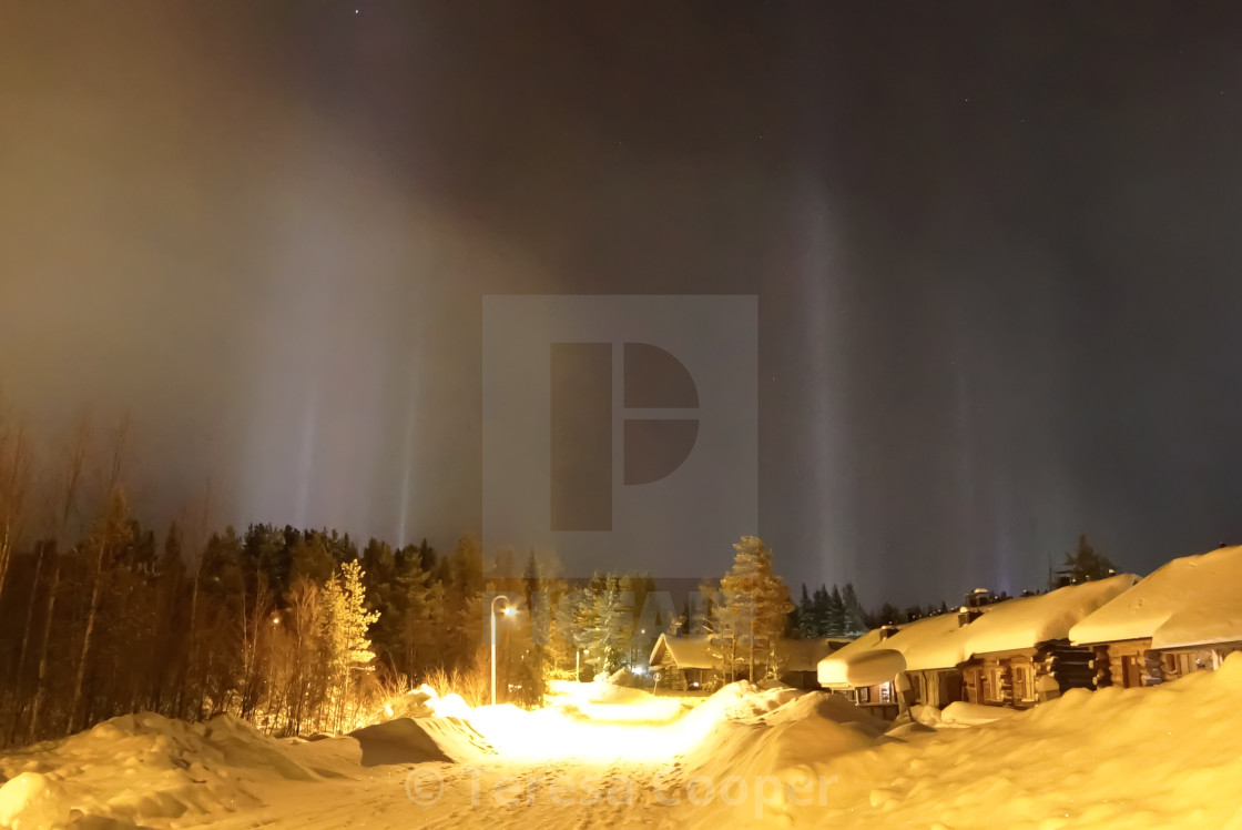 "Light pillars reach to the sky" stock image