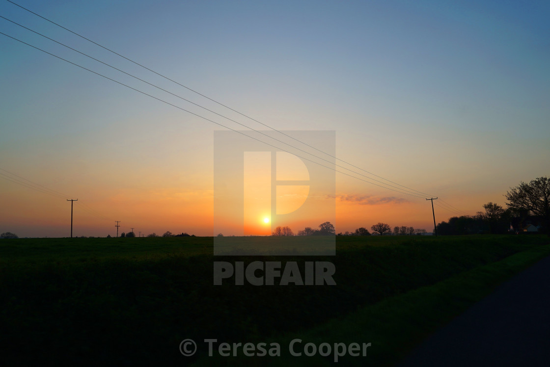 "The sun rises over the horizon in Essex" stock image