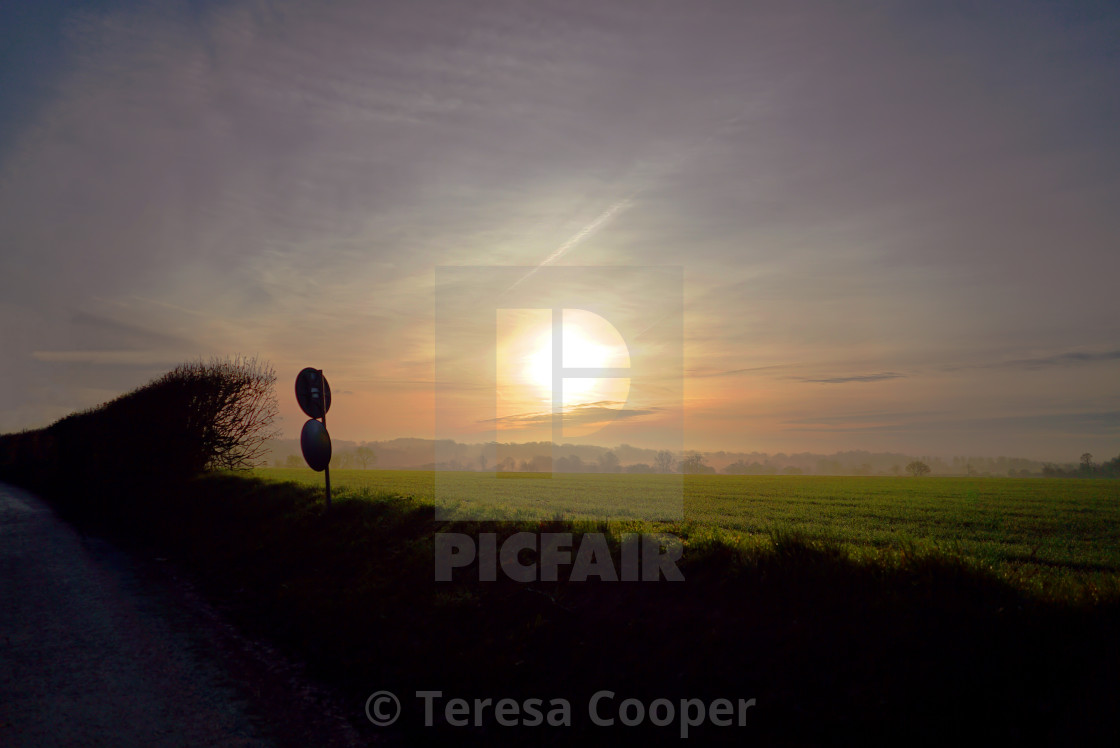 "Sunrise over the fields and country lanes" stock image