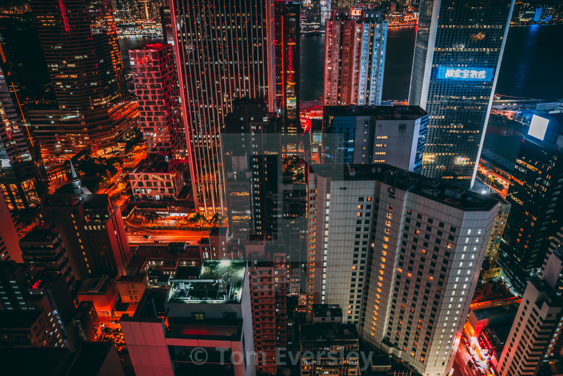"Modern skyscraper buildings on Hong Kong skyline at night" by Tom Eversley - $15.41 "Modern skyscraper buildings on Hong Kong skyline at night" stock image