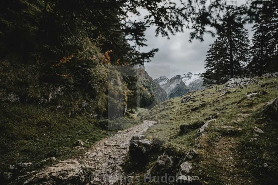 "Stony trail in the Switzerland mountains to the lake Seealpsee during the cloudy autumn afternoon" by Tomáš Hudolin - $22.96 "Stony trail in the Switzerland mountains to the lake Seealpsee during the cloudy autumn afternoon" stock image