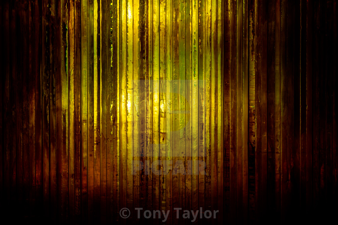 Thick Bright Orange Glass With Light Shining Through From