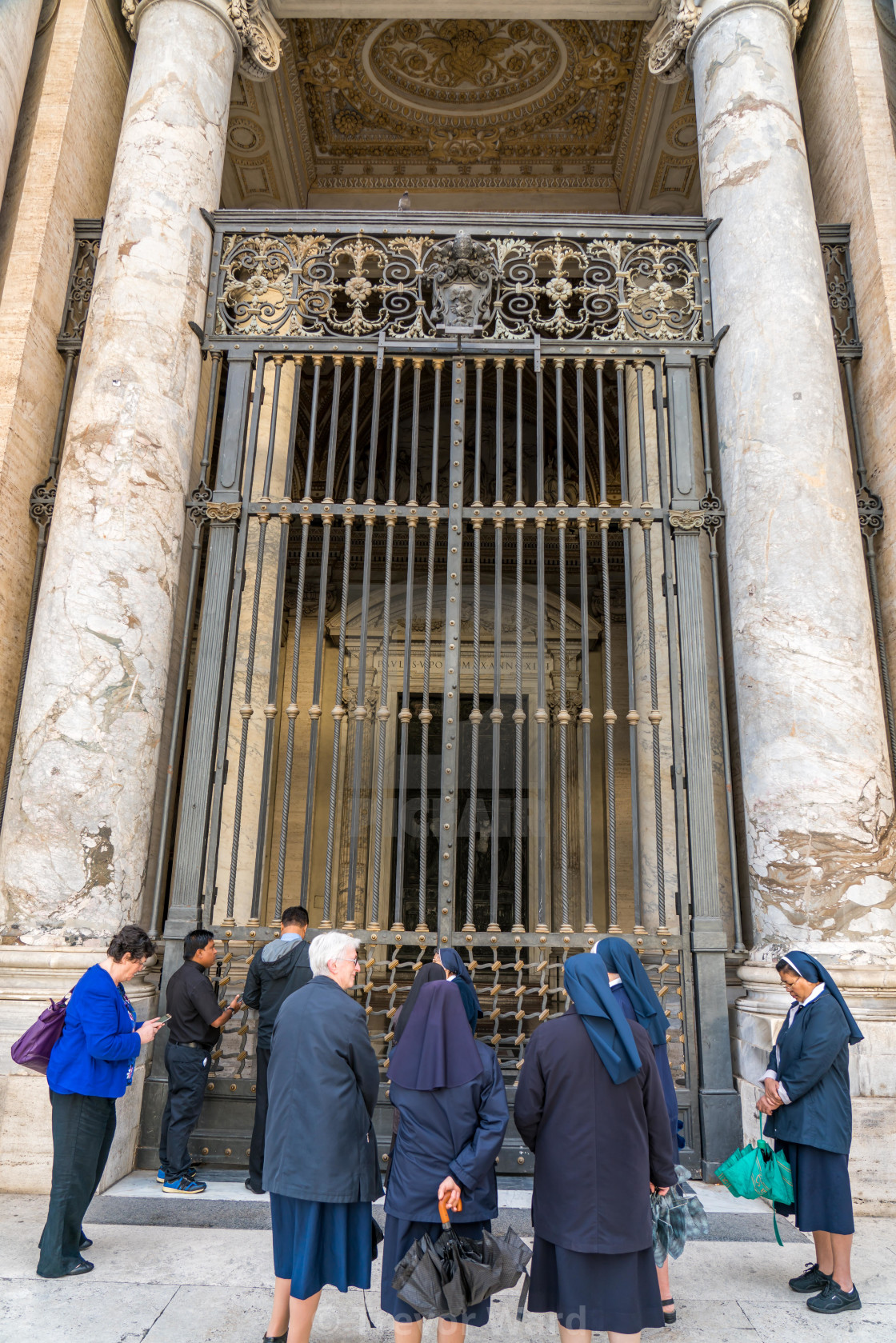Front Door Of St Peter S Basilica In Rome Nuns And Tourists Wa