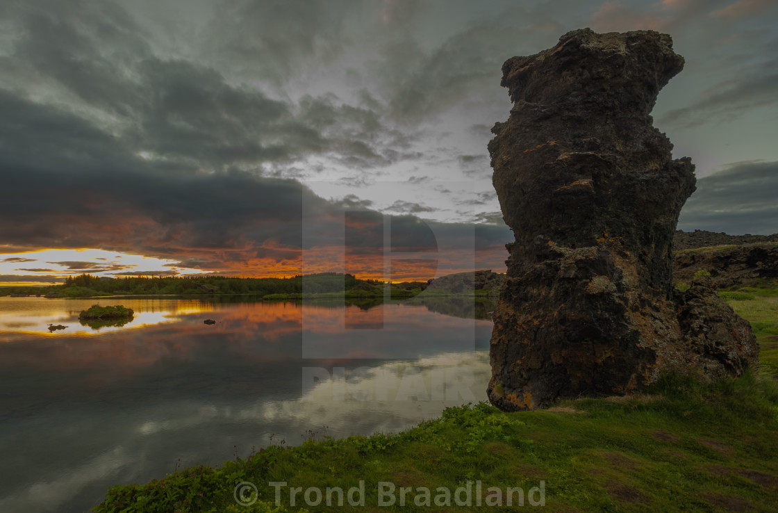 "Sunset over lava pillar at lake myvatn" stock image