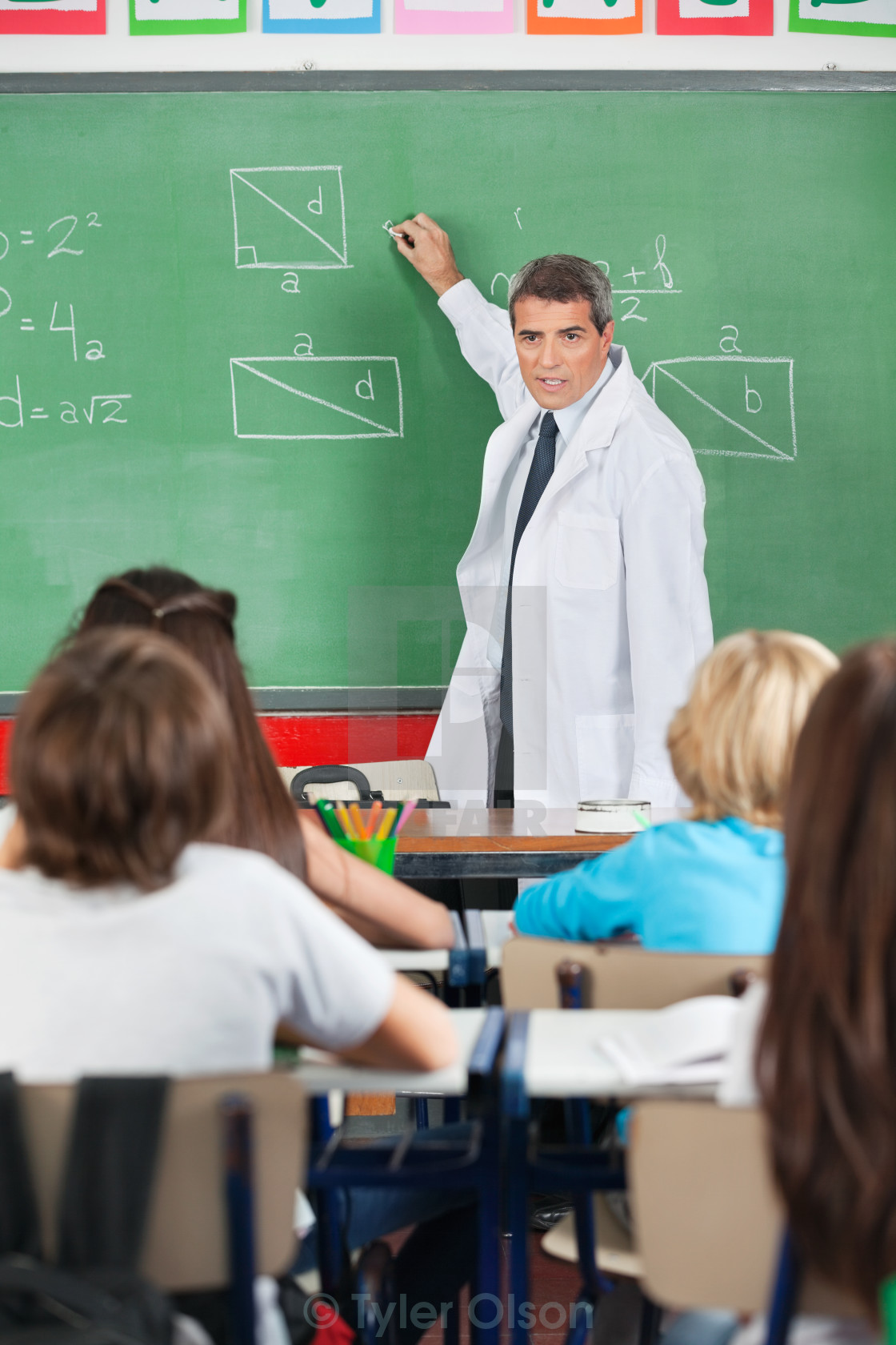 teacher writing on board