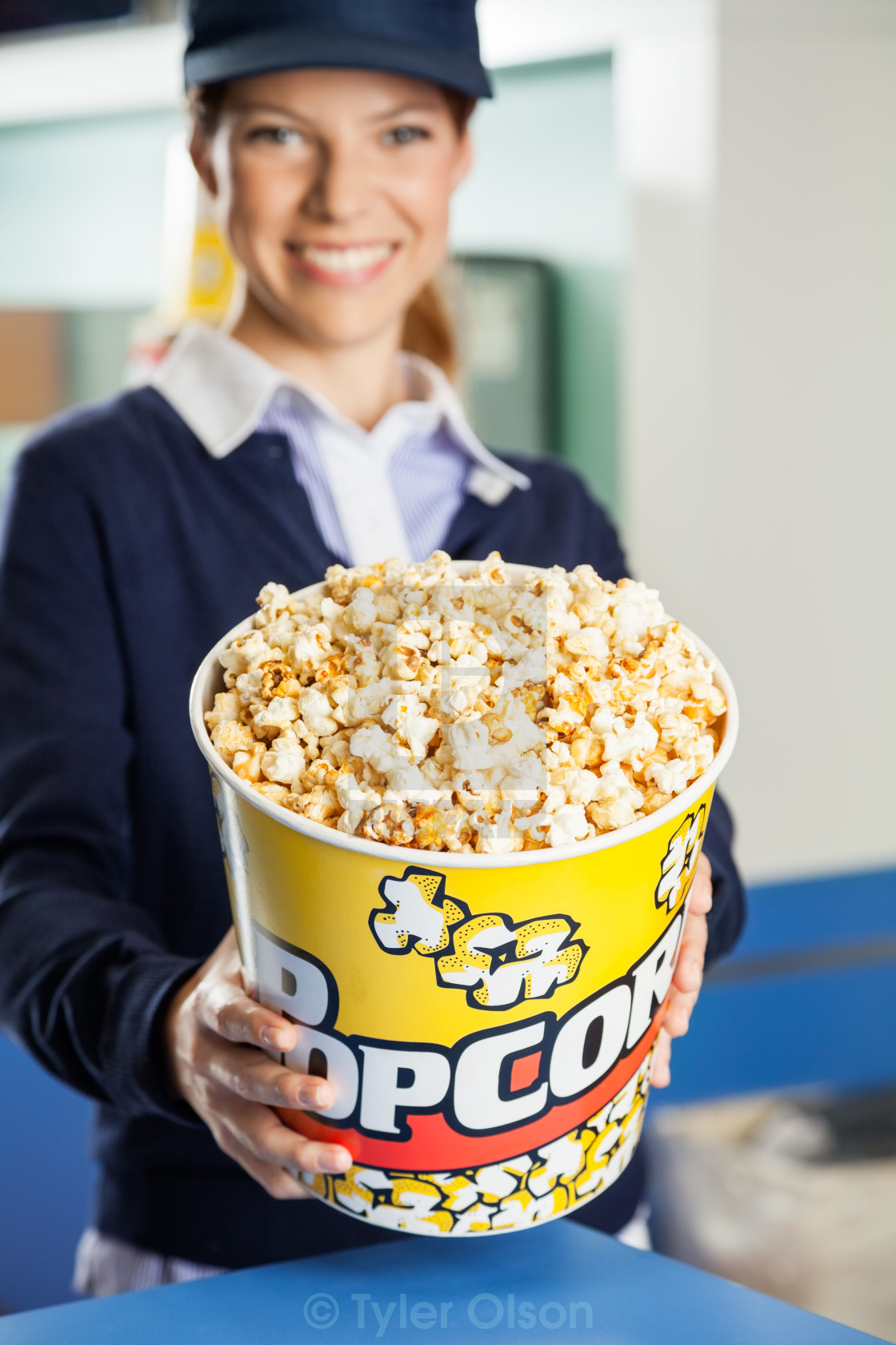 Happy Worker Offering Popcorn At Cinema Concession Stand License Download Or Print For 12 40 Photos Picfair