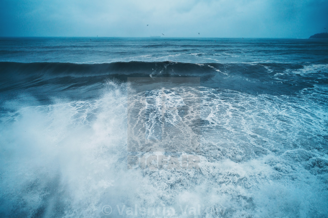 Aerial View Of Sea Waves And Dramatic Clouds License
