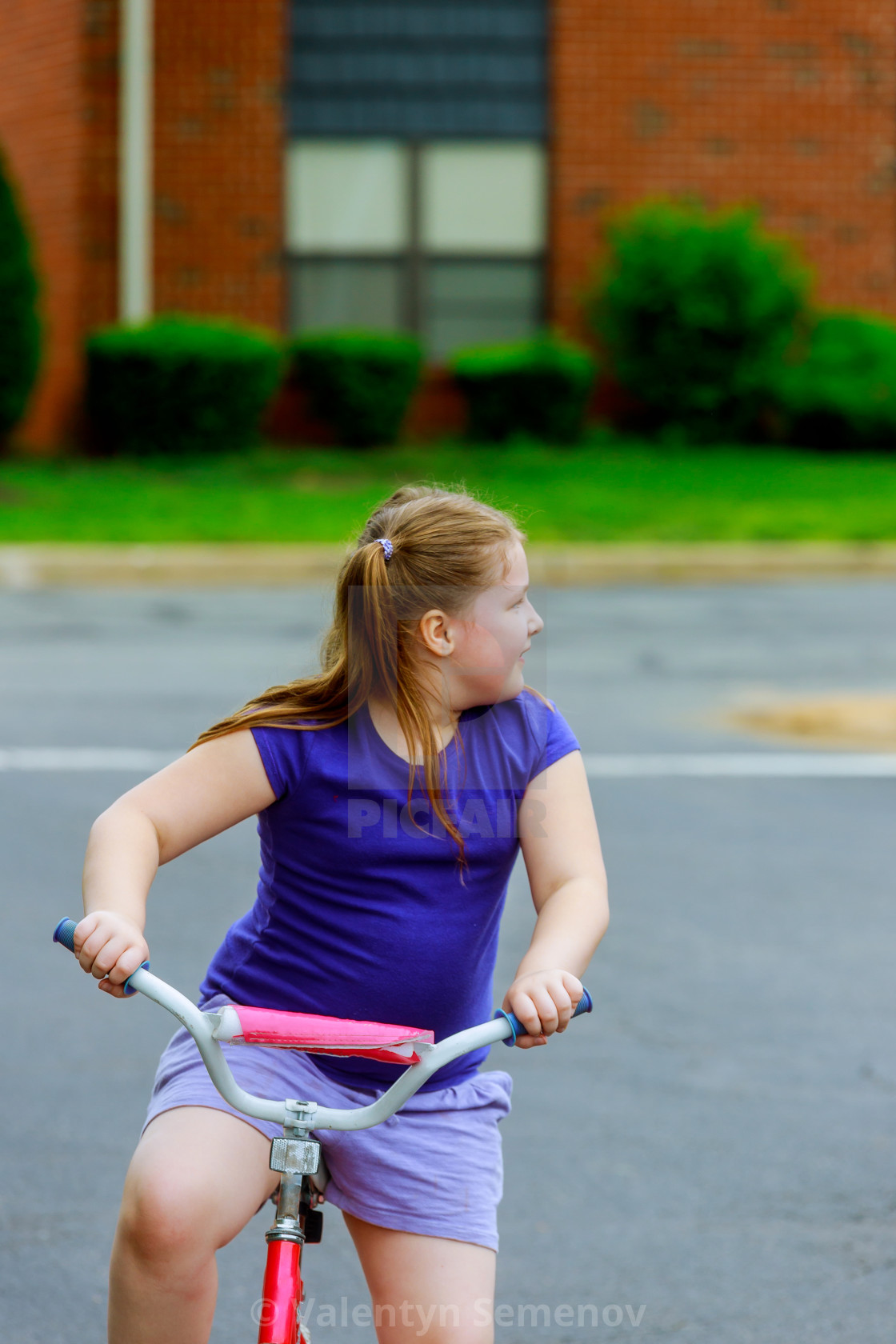 little girl on bike