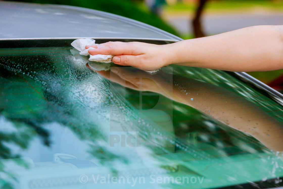 Women Hand Dry Wiping Car Surface With Microfiber Cloth After