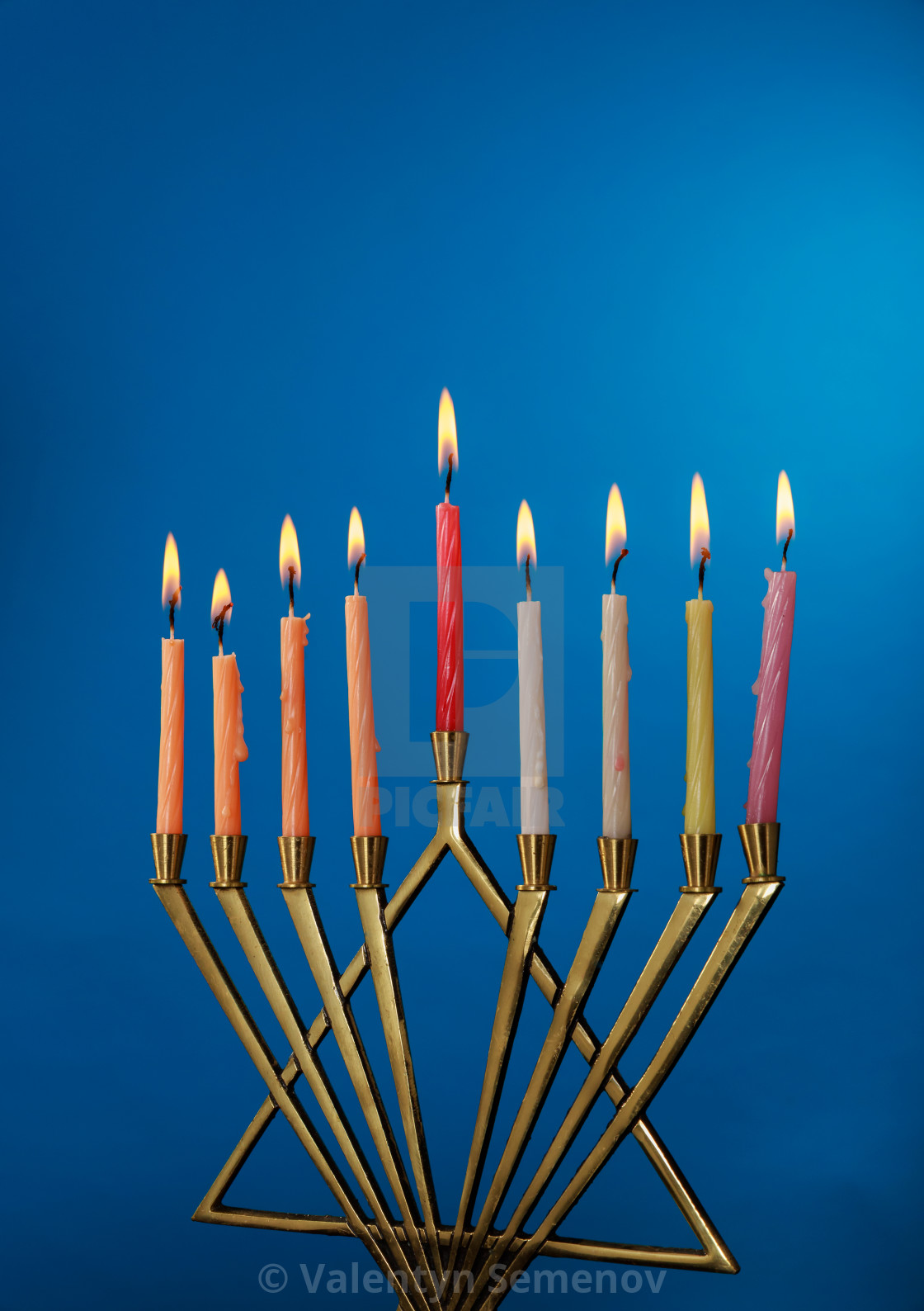 Burning Hanukkah Candles In A Menorah On Blue Background License Download Or Print For 6 82 Photos Picfair