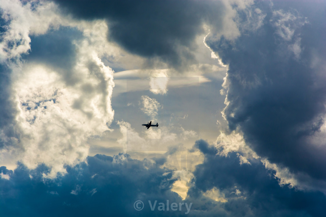 Big plane on background of the cloudy sky. - License, download or print for  £ | Photos | Picfair