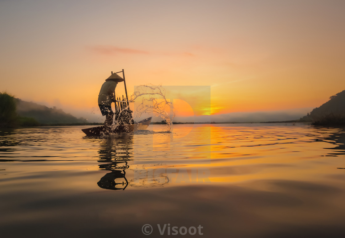 "Fishermen in action when fishing in the river" stock image