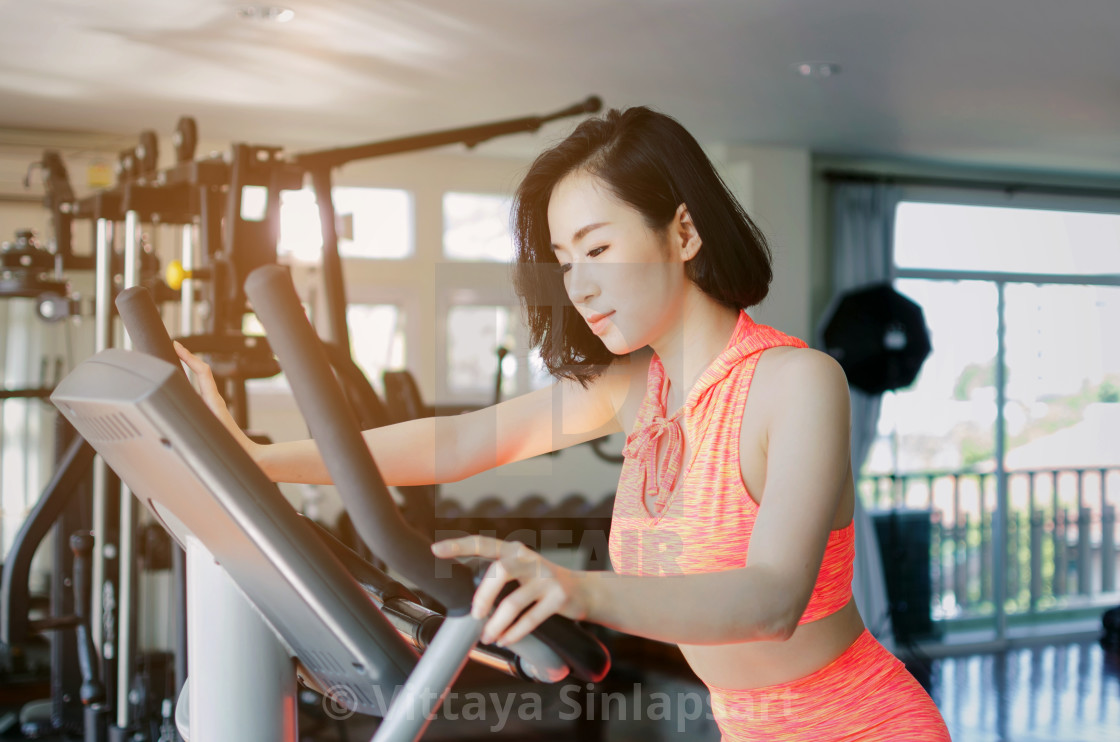 asian young beautiful woman slim body exercising her legs cardio training on bicycle in fitness gym for good healthy at the morning, bodybuilder, lifestyle, exercise fitness, workout and sport concept - License, Asian Young Beautiful Woman Slim Body Exercising Her Legs Cardio Training On Bicycle In Fitness Gym For Good Healthy At The Morning, Bodybuilder, Lifestyle, Exercise Fitness, Workout And Sport Concept - License,