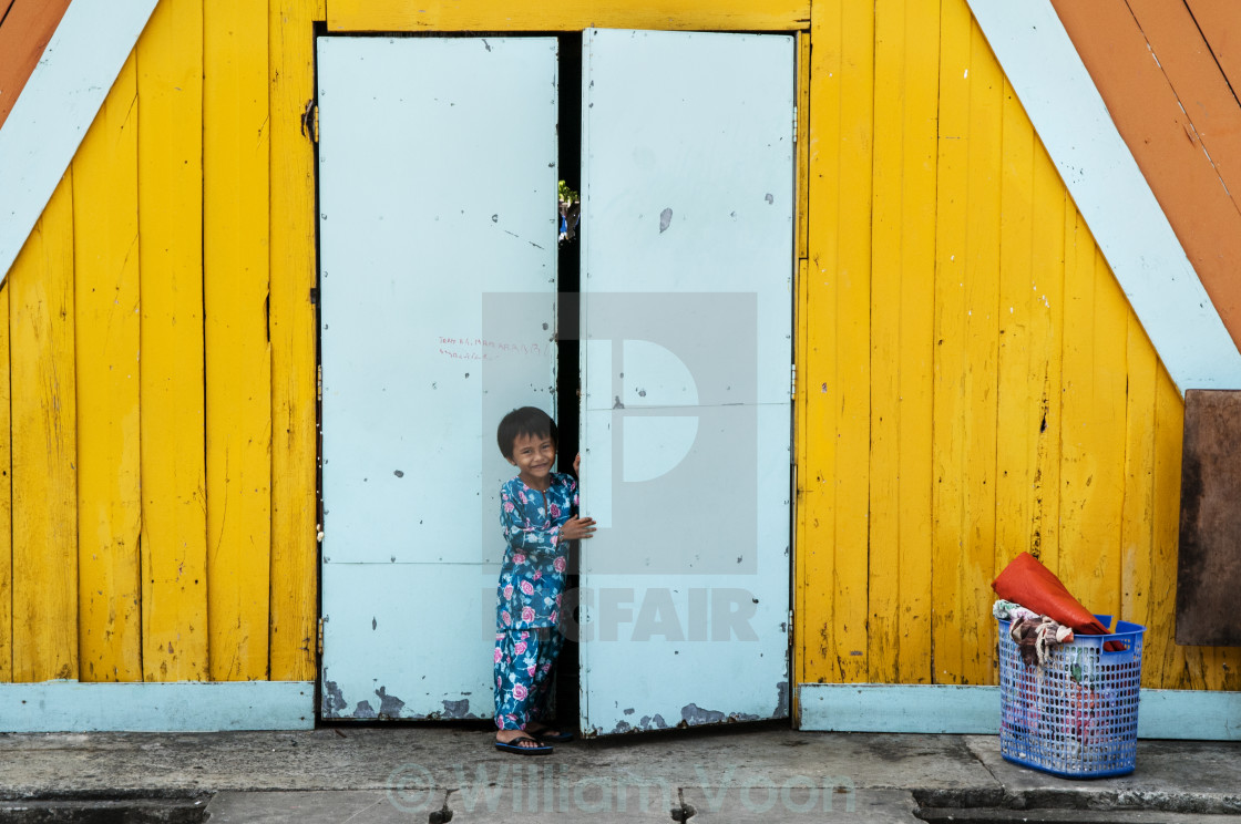 "Young Girl Opening Door" stock image