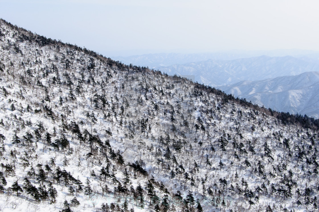 "Snow covered mountain peaks" stock image