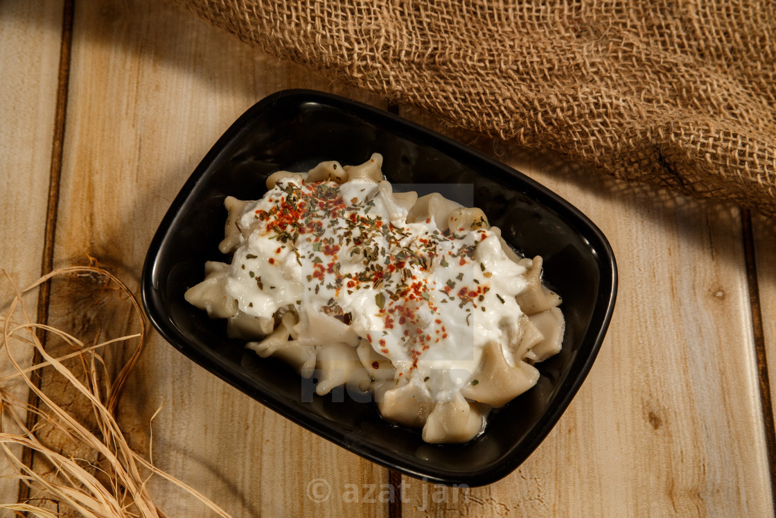 Turkish Manti Manlama On Plate With Red Pepper Tomatoes Sauce License Download Or Print For 6 20 Photos Picfair