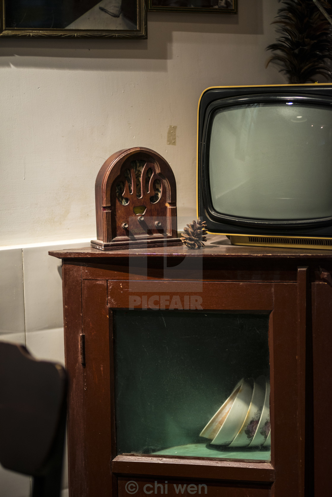 An Old Tv And An Old Radio On A Chinese Style Cabinet License