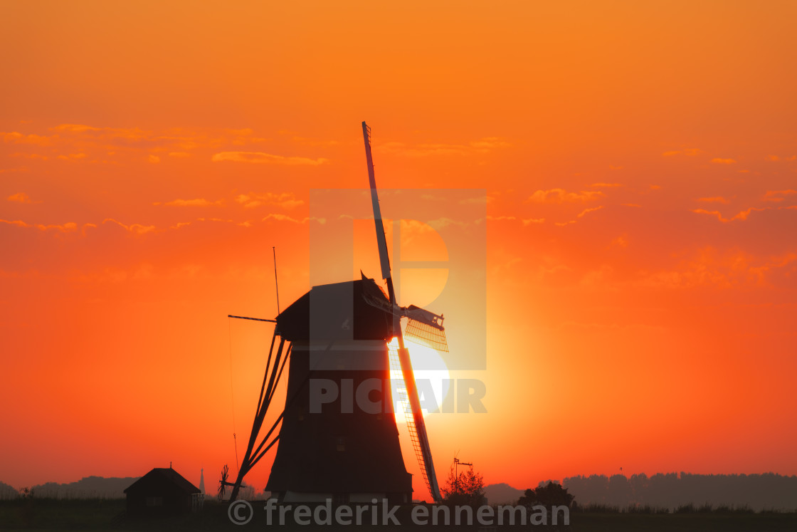 "Dutch Windmill at sunrise" stock image