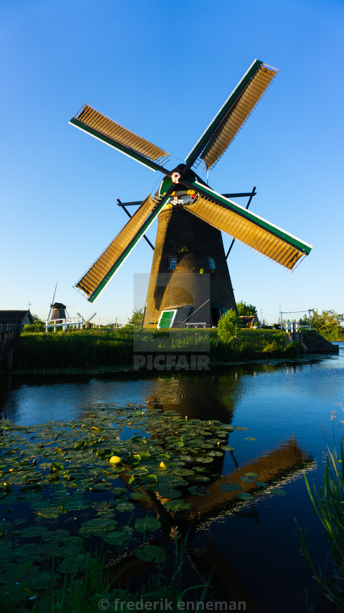 "Dutch windmill at the polder" stock image