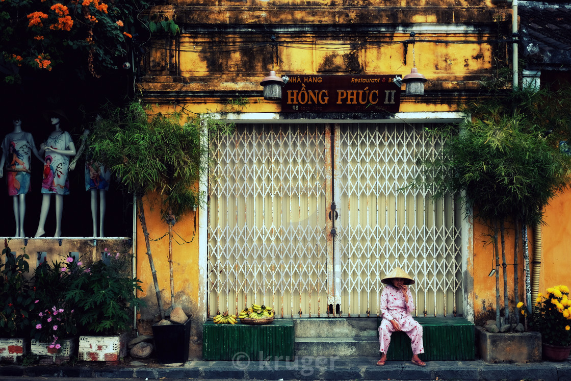 "An old woman - banana seller at Hoi An ancient town" stock image