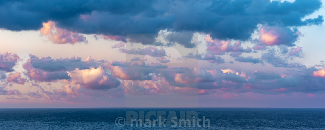 "Pink fluffy clouds over English Channel" stock image