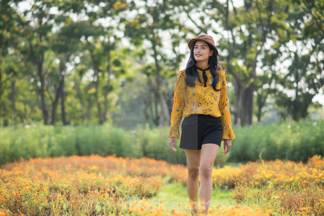 Bohemian Asian girl in flower garden field - License, download or print for  £12.40 | Photos | Picfair