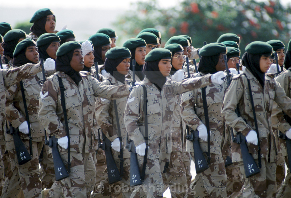 "Female armed soldiers parade in camouflage uniform in Abu Dhabi for..." stock image